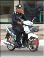 Pattaya Policemen are driving motorcycles without wearing helmets!